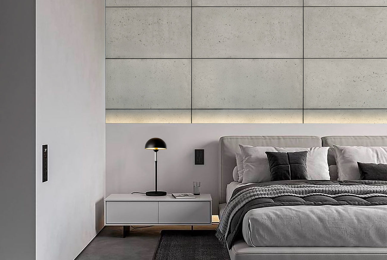 Luxury modern bedroom with silica-free concrete wall panels, ambient LED lighting, and minimalist decor for a contemporary design aesthetic.