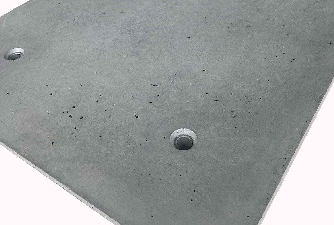 Close-up of lightweight silica-free concrete panel with anchor points, showcasing modern industrial texture and durable exterior wall cladding.