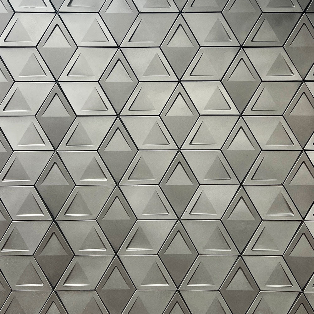 Close-up view of geometric 3D panels featuring a modern triangular pattern, creating a textured and sophisticated surface design