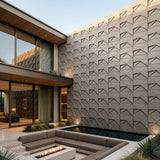Modern outdoor living space with 3d tiles angle wall design and seating area. - FLOAT Concrete