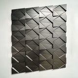 3D wall panel featuring a kinetic metallic coating, creating a dynamic and reflective surface for modern interiors