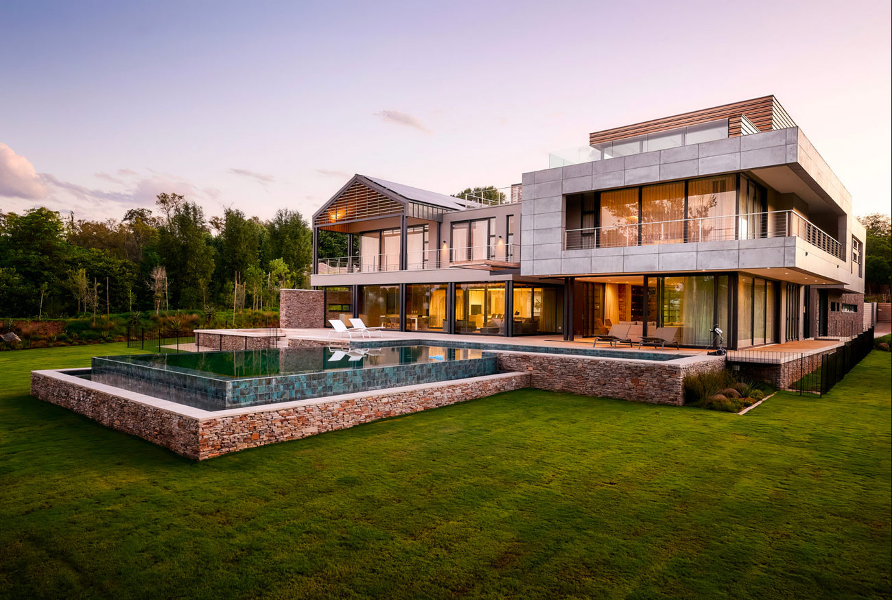 Concrete lightweight panels on a modern house surrounded by nature, providing durability and a sleek look for outdoor environments