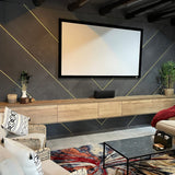 Living room with concrete wall paneling behind home theater screen – FLOAT Concrete