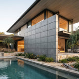 Modern house with a pool and outdoor seating area. - FLOAT concrete