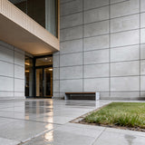 Modern commercial building entrance with concrete panel wall, architectural concrete panels, and minimalist contemporary exterior design - FLOAT Concrete