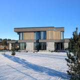Contemporary house exterior featuring architectural concrete wall panels, wood facade elements and modern architecture - FLOAT concrete