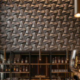 Bar area, wine bottles on shelves with concrete wall tiles. - FLOAT concrete