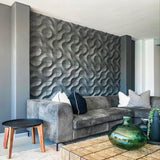 Geometric wall panels with intricate 3D patterns adding depth and modern style to a living room accent wall