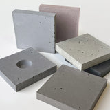 Sample pack of six nature-inspired wall concrete panels in greys and earthy tones