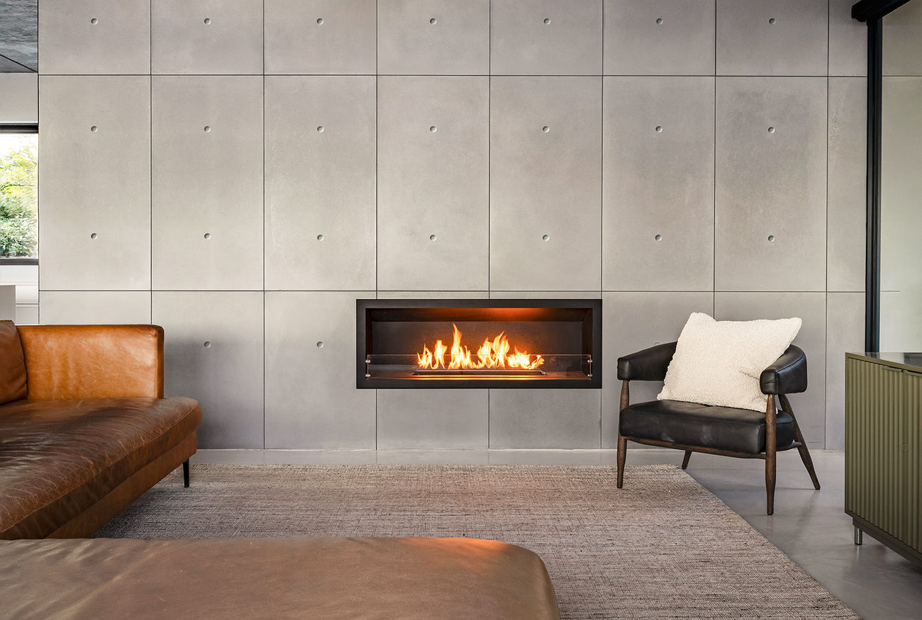 Wall concrete panels used in modern interior architecture with integrated fireplace in living room with leather couch
